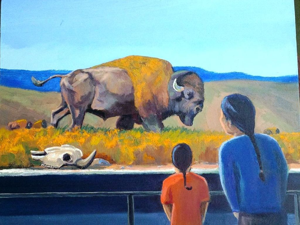 a boy and his grandfather looking at a buffalo display